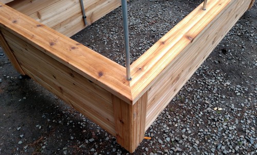 raised bed being built - showing quality materials - cedar wood and support post